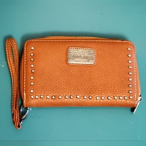 Trinity Ranch brown wallet with zipper closure and clutch pull